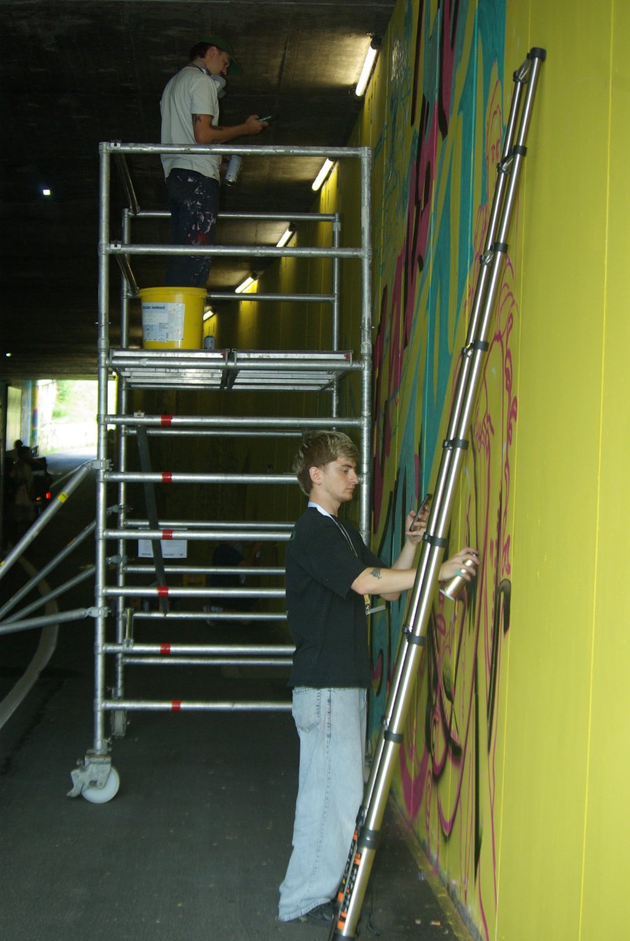 Painting a mural in an underpass in Linz